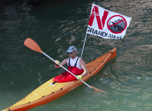 Protester against cruise ships in Venice on kayak in lagoon