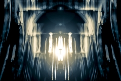 Symbolic image of Christian cross emerging in light from the window of a church