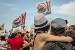 Two lovers hugging in front of protesters against cruise ships in Venice